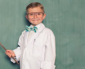 Image of a child dressed as a teacher