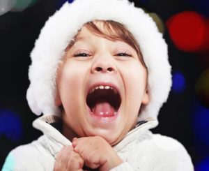 Image of a child excited about Christmas